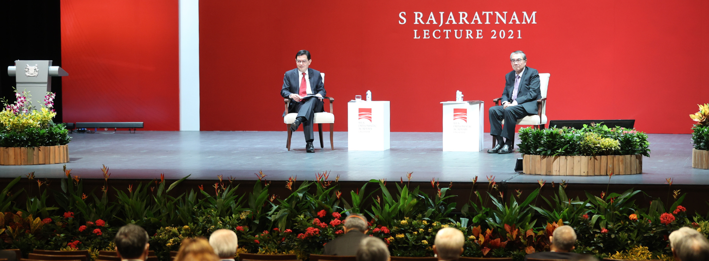 Two speakers sit on stage at S Rajaratnam Lecture 2021; audience seated below.